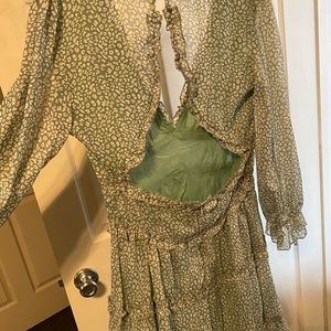 green and white long sleeve open back dress